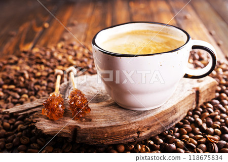 Cup of coffee on wooden background. 118675834