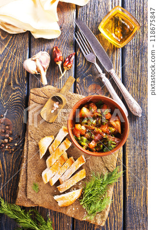 chicken fillet on board with vegetable stew in bowl chicken fillet on board with vegetable stew in bowl 118675847