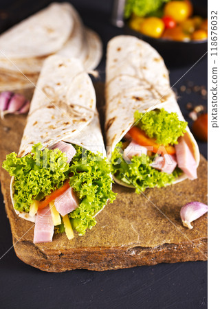 Fresh tortilla wraps with ham cheese and vegetables 118676032