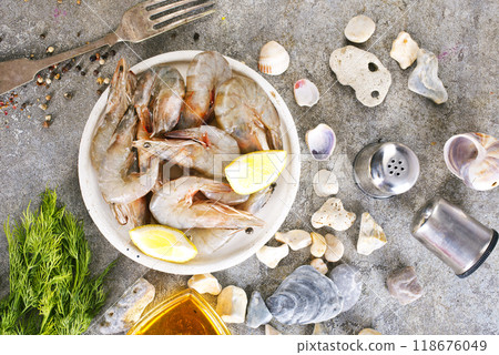 raw shrimps on white plate raw shrimps on white plate 118676049
