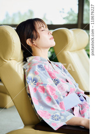 Woman relaxing at the inn Woman relaxing at the inn 118676227