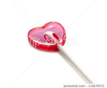 Red heart shaped lollipop isolated on white background Red heart shaped lollipop isolated on white background 118676551