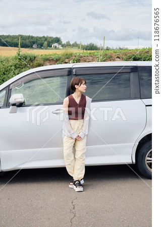 A woman driving through the great outdoors 118676565