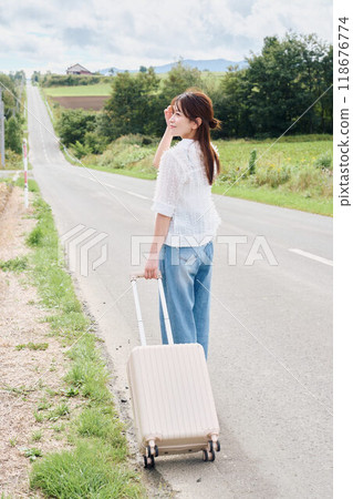 Woman traveling alone 118676774