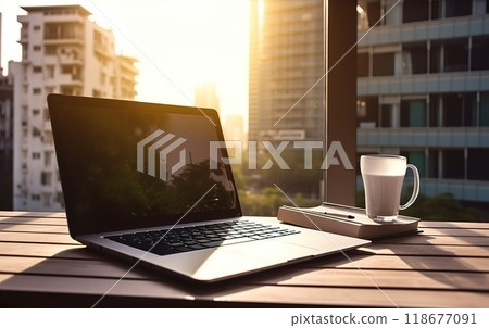 A laptop is placed on a wooden table beside a cup of coffee 118677091