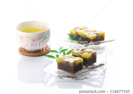 Yokan (steamed chestnut yokan) served on a glass plate on a white background Yokan (steamed chestnut yokan) served on a glass plate on a white background 118677585