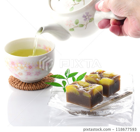 Yokan (steamed chestnut yokan) served on a glass plate on a white background Yokan (steamed chestnut yokan) served on a glass plate on a white background 118677593