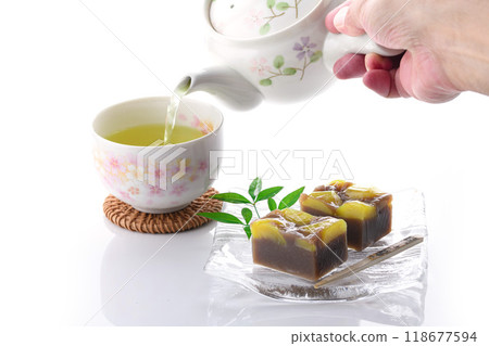 Yokan (steamed chestnut yokan) served on a glass plate on a white background Yokan (steamed chestnut yokan) served on a glass plate on a white background 118677594