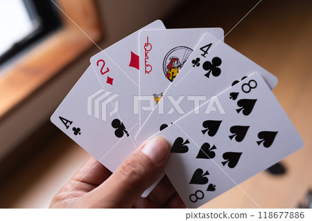 person with playing cards person with playing cards 118677886
