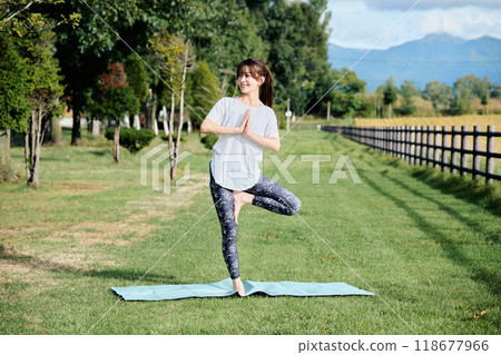 woman doing yoga in nature 118677966