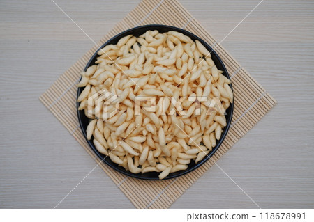 telur gabus sticks in a black plate on wooden table telur gabus sticks in a black plate on wooden table 118678991