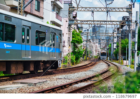 Odakyu Line, a local train running through a residential area 118679697