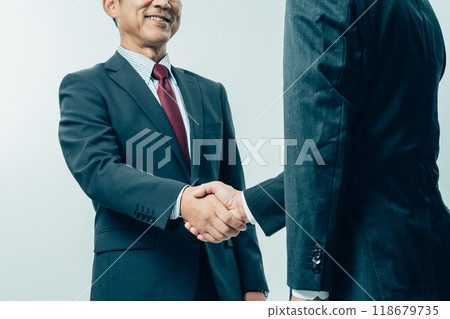 Businessman shaking hands Businessman shaking hands 118679735