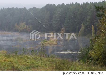 Foggy morning on a lake in autumn. Nature of Eastern Siberia 118679944