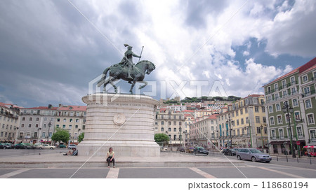 Figueira Square in the Baixa district. King Dom Joao I statue and Sao Jorge Castle on top of hill timelapse hyperlapse 118680194