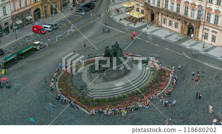 Aerial view of Old Town Square and Jan Hus monument timelapse. People sitting and walking around in Prague, Czech Republic Aerial view of Old Town Square and Jan Hus monument timelapse. People sitting and walking around in Prague, Czech Republic 118680202