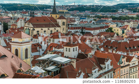 Aerial timelapse view of the traditional red roofs of the city of Prague, Czech Republic with the church of St. Jilji Aerial timelapse view of the traditional red roofs of the city of Prague, Czech Republic with the church of St. Jilji 118680203