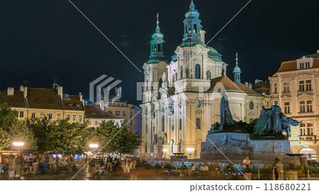 Baroque St. Nicholas' Cathedral on the Oldtown Square in Prague with monument Jan Hus illuminated at night timelapse Baroque St. Nicholas' Cathedral on the Oldtown Square in Prague with monument Jan Hus illuminated at night timelapse 118680221