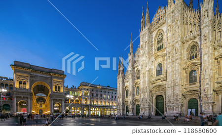 Cathedral Duomo di Milano and Vittorio Emanuele gallery day to night timelapse in Square Piazza Duomo, Milan, Italy. 118680600