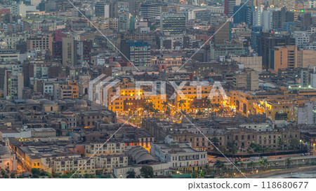 Aerial top view of Lima main square from San Cristobal hill day to night timelapse, government palace of Peru and cathedral church. Aerial top view of Lima main square from San Cristobal hill day to night timelapse, government palace of Peru and cathedral church. 118680677