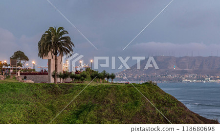 Intihuatana park with panoramic view of Miraflores district and Morro Solar hill on a background day to night timelapse, in Lima, Peru 118680698