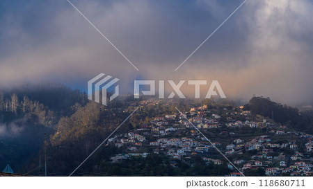 Sunset over houses on hill in Funchal, Madeira, Portugal timelapse 118680711