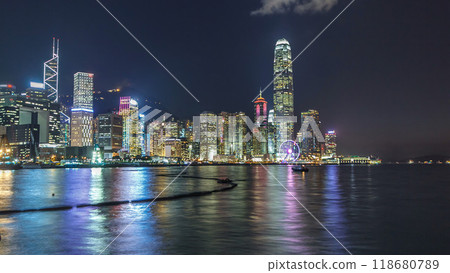 Hong Kong, China skyline panorama with skyscrapers at night from across Victoria Harbor timelapse. Hong Kong, China skyline panorama with skyscrapers at night from across Victoria Harbor timelapse. 118680789