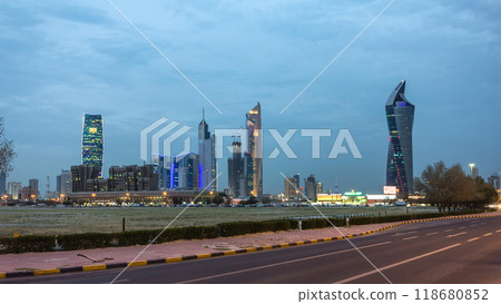 Skyline with Skyscrapers day to night timelapse in Kuwait City downtown illuminated at dusk. Kuwait City, Middle East 118680852