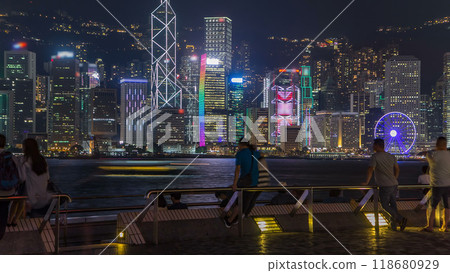 Hong Kong city skyline at night over Victoria Harbor with clear sky and urban skyscrapers timelapse hyperlapse. Hong Kong city skyline at night over Victoria Harbor with clear sky and urban skyscrapers timelapse hyperlapse. 118680929