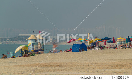 People on the Jumeirah Beach in Dubai, UAE. Timelapse 118680979