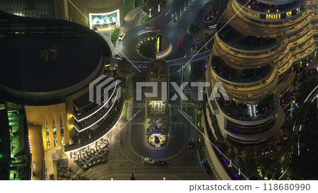 Dubai downtown intersection traffic night with city lights from above timelapse 118680990