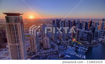 Sunrise in Dubai Marina with towers and harbor with yacht from skyscrapers rooftop, Dubai, UAE timelapse Sunrise in Dubai Marina with towers and harbor with yacht from skyscrapers rooftop, Dubai, UAE timelapse 118681029