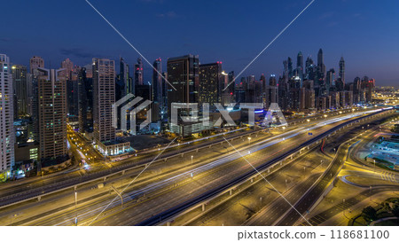 Dubai Marina skyscrapers aerial top view before sunrise from JLT in Dubai night to day timelapse, UAE. 118681100
