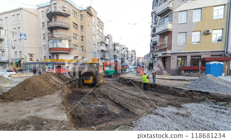 Industrial machinery at working construction building site timelapse. Bulldozer and crane working on ground 118681234