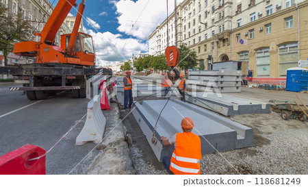 Installing concrete plates by crane at road construction site timelapse hyperlapse. Installing concrete plates by crane at road construction site timelapse hyperlapse. 118681249