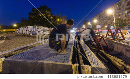 Road construction site with tram tracks repair and maintenance timelapse hyperlapse. Road construction site with tram tracks repair and maintenance timelapse hyperlapse. 118681279
