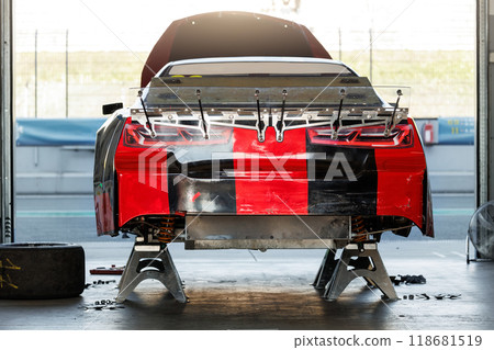 Back view Nascar Whelen euro series racing sportscar vehicle    Motorsport Arena garage box race track pit paddock hanged on hydraulic  jack lift . European motor auto sport competition 118681519