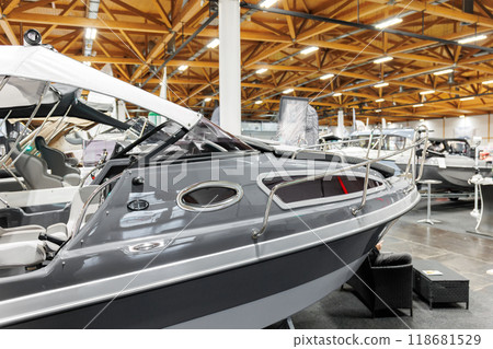 Many small big ship yachts at boat show exhibition indoors hall. Marine fishing yachting sailing vessel expo commercial trading business. Modern recreation sport water transport fair Many small big ship yachts at boat show exhibition indoors hall. Marine fishing yachting sailing vessel expo commercial trading business. Modern recreation sport water transport fair 118681529