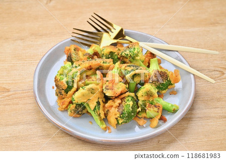 Broccoli piccata, baked with flour, egg and grated cheese. Broccoli piccata, baked with flour, egg and grated cheese. 118681983