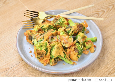 Broccoli piccata, baked with flour, egg and grated cheese. 118681984