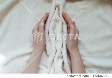 Female hands hugging folds of soft tissue in the shape of the labia, vagina and vulva. The concept of women's intimate health, prevention of gynecological diseases Female hands hugging folds of soft tissue in the shape of the labia, vagina and vulva. The concept of women's intimate health, prevention of gynecological diseases 118682049