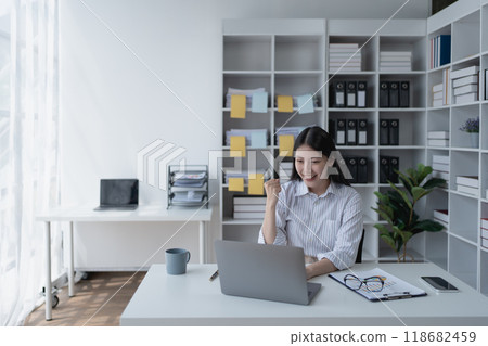 woman happiness plans for financial success by integrating budget and marketing strategies to optimize overall finance management 118682459