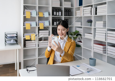 business woman using smartphone calling to plan a marketing strategy for finance with consult aiming to align financial goals with market opportunities business woman using smartphone calling to plan a marketing strategy for finance with consult aiming to align financial goals with market opportunities 118682701