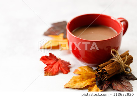 Red cup of delicious hot chocolate on white table background. Red cup of delicious hot chocolate on white table background. 118682920