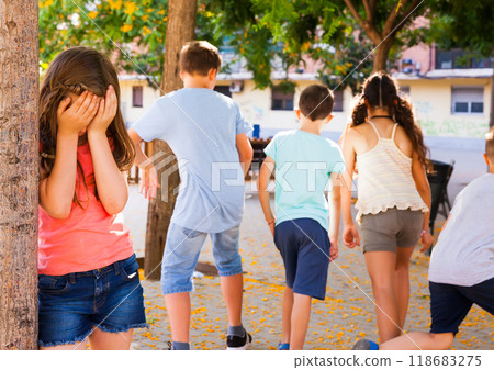 Playing hide and seek. The girl closed her eyes 118683275