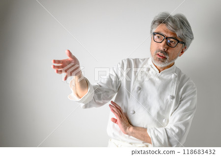 A chef who is strict about the taste of his food A chef who is strict about the taste of his food 118683432