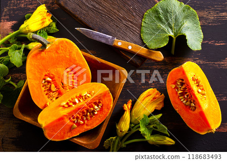 fresh pumpkin on wooden table, raw pumpkin fresh pumpkin on wooden table, raw pumpkin 118683493