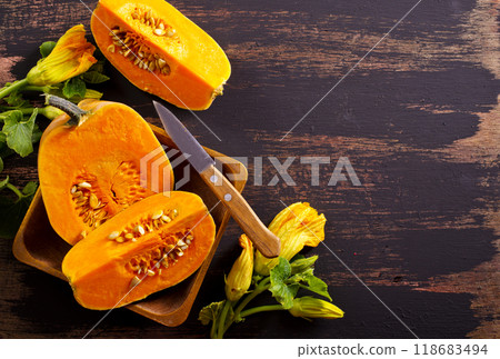 fresh pumpkin on wooden table, raw pumpkin fresh pumpkin on wooden table, raw pumpkin 118683494