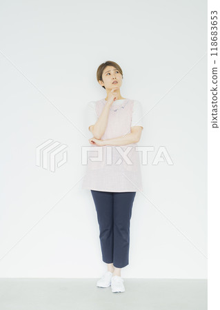 Nursery teacher, woman in apron 118683653
