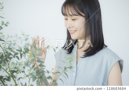 Young woman in a light blue dress 118683684